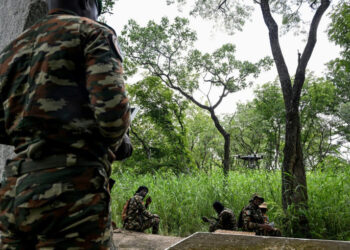 Ivorian park rangers patrol Comoe National Park using drones to monitor illegal gold mining activity in the protected forest.