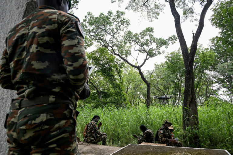 Ivorian park rangers patrol Comoe National Park using drones to monitor illegal gold mining activity in the protected forest.