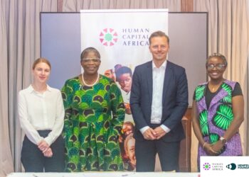 Four representatives from Human Capital Africa and the Hempel Foundation pose after signing a new two-year partnership to strengthen foundational learning across sub-Saharan Africa.
