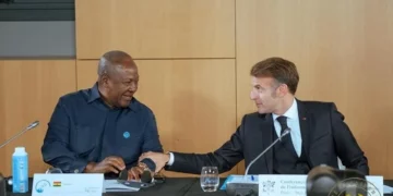 President John Dramani Mahama of Ghana and French President Emmanuel Macron share a light moment during bilateral talks at the Élysée Palace in Paris.