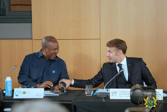 President John Dramani Mahama of Ghana and French President Emmanuel Macron share a light moment during bilateral talks at the Élysée Palace in Paris.