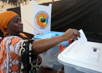 A woman casts her ballot at a polling station in Dar es Salaam during Tanzania’s national election.