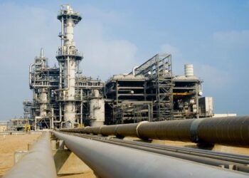 Natural gas processing plant with pipelines in Africa, highlighting infrastructure gaps and unmet gas potential