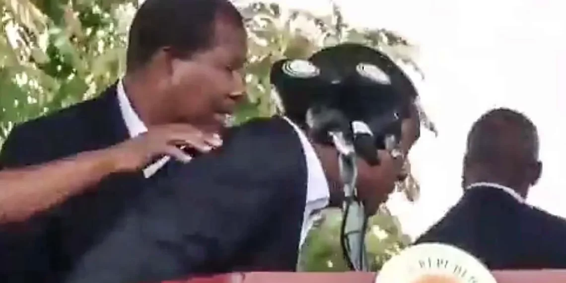 Zambia’s president is rushed from a podium by security officers as objects are thrown during unrest in Chingola.