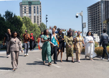 A group of African influencers and delegates walk together outside the African Union Headquarters in Addis Ababa during the 2025 High-Level Influencers Forum on Borderless Africa.