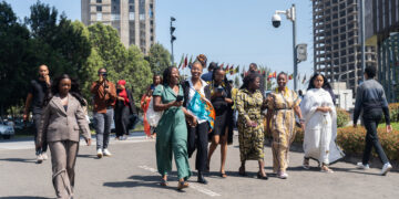 A group of African influencers and delegates walk together outside the African Union Headquarters in Addis Ababa during the 2025 High-Level Influencers Forum on Borderless Africa.