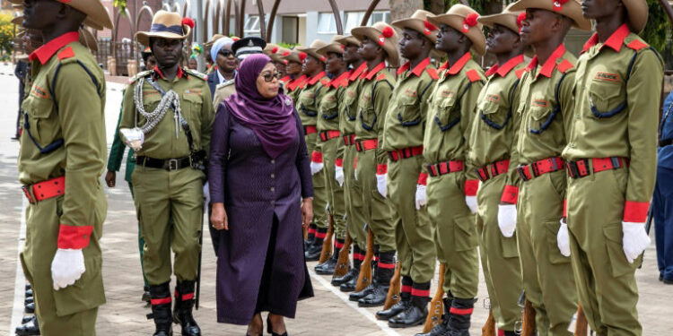 President Samia Suluhu Hassan inspecting an honour guard during a ceremony outside parliament in Tanzania.