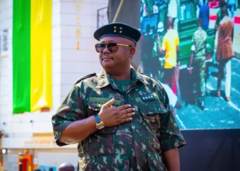 A senior military officer in camouflage uniform stands with his hand on his chest during an official event in Bissau, Guinea-Bissau.