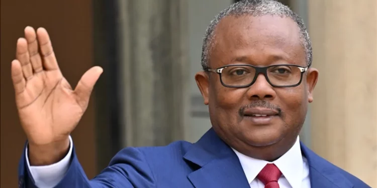 President Umaro Sissoco Embalo waving during a public appearance in Guinea-Bissau.