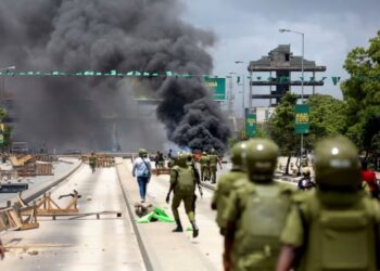 Protesters facing Tanzanian security forces during post-election unrest in Dar es Salaam, amid reports of violence, arrests and media restrictions