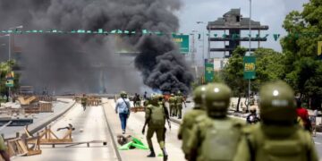 Protesters facing Tanzanian security forces during post-election unrest in Dar es Salaam, amid reports of violence, arrests and media restrictions