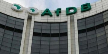 Exterior view of the African Development Bank Group headquarters building with the AfDB logo.