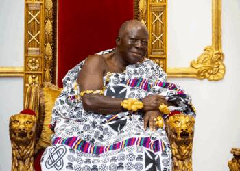 Asantehene Otumfuo Osei Tutu II seated on his golden throne at the Manhyia Palace in Kumasi, adorned in traditional kente and gold regalia.