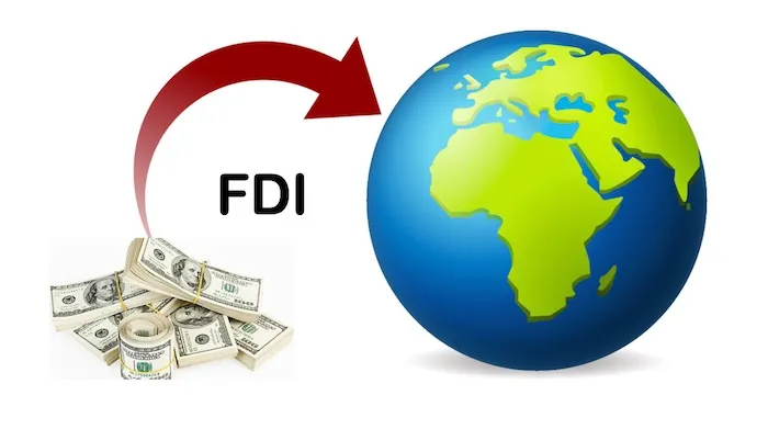 Illustration showing foreign direct investment (FDI) flow into Africa, with an arrow from dollar bills pointing towards the African continent on a globe.