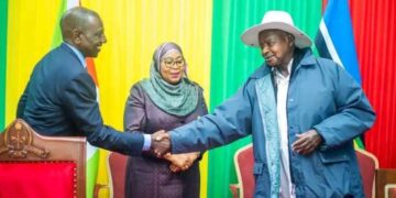 Leaders from Kenya, Tanzania, and Uganda greet each other during an East African Community meeting.