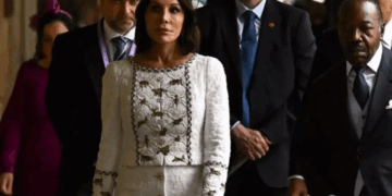 Former Gabonese First Lady Sylvia Bongo Ondimba walks alongside officials during a public event in London.