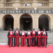 Judges of the Supreme Court of Kenya stand in their official robes on the steps of the Supreme Court building in Nairobi.
