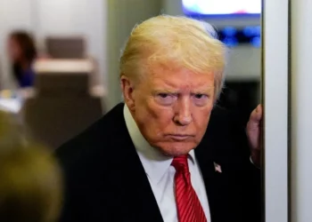 US President Donald Trump looks on aboard Air Force One after warning of possible military action in Nigeria.