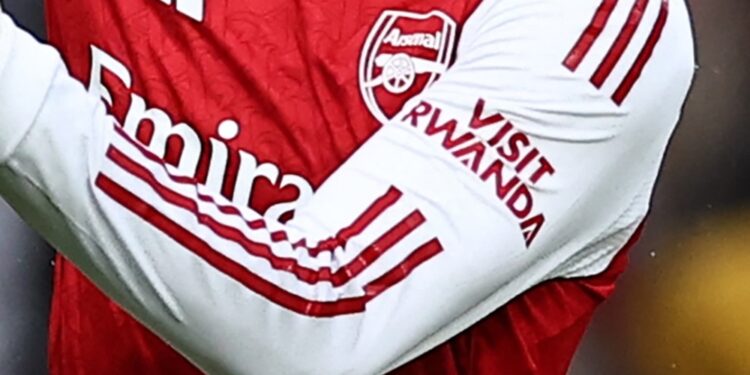 Arsenal player’s shirt showing the ‘Visit Rwanda’ logo on the sleeve during a match.
