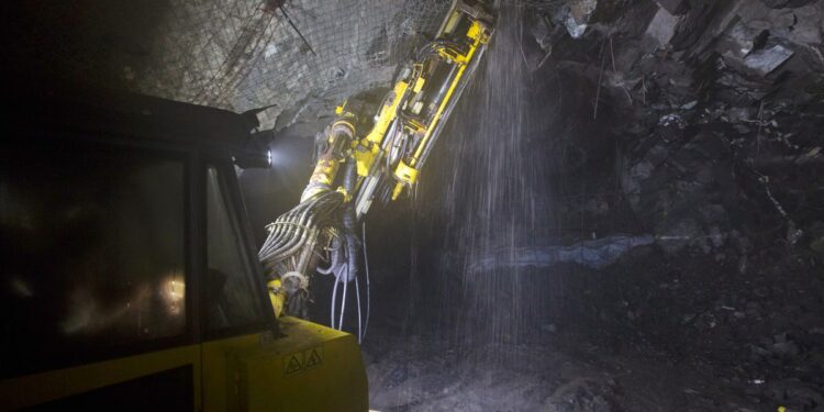 Underground mining machine drilling into rock at a Zambian copper operation