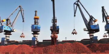 Bulk carrier loading bauxite ore at a port in Guinea amid renewed supply talks with Emirates Global Aluminium.