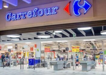 Carrefour supermarket entrance with branded signage and checkout area inside a modern retail store