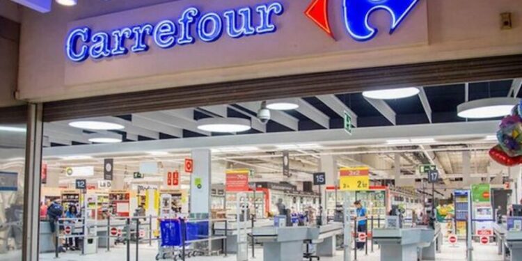 Carrefour supermarket entrance with branded signage and checkout area inside a modern retail store