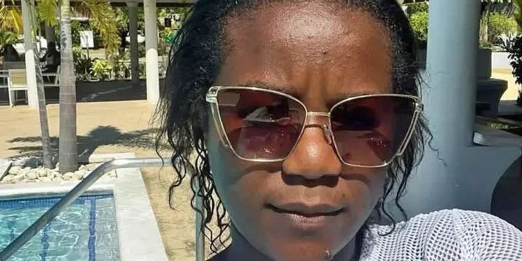 Portrait of Zambian-American influencer Ethel Chisono Edwards wearing sunglasses outdoors.