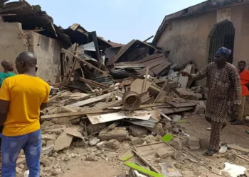 Residents inspect collapsed buildings and debris after US-backed air strike debris landed near homes in a rural Nigerian community, causing damage but no reported casualties