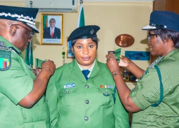 Zambian police officer Ruth Nyambe is formally decorated by senior officers during a promotion ceremony following her rejection of a $50,000 bribe at Lusaka’s main airport