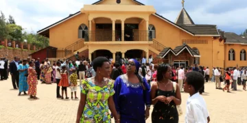 Worshippers gather outside a church in Rwanda as authorities enforce closures of thousands of evangelical churches under a 2018 religious regulation law