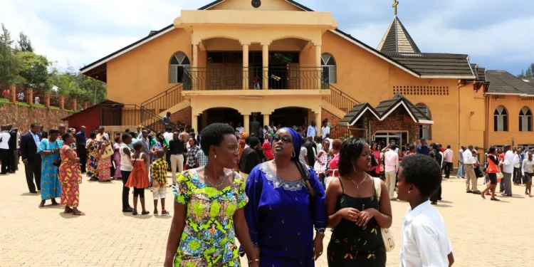 Worshippers gather outside a church in Rwanda as authorities enforce closures of thousands of evangelical churches under a 2018 religious regulation law