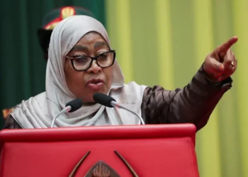 Tanzania’s President Samia Suluhu Hassan speaking at a podium and pointing during a public address in Dar es Salaam