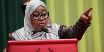 Tanzania’s President Samia Suluhu Hassan speaking at a podium and pointing during a public address in Dar es Salaam