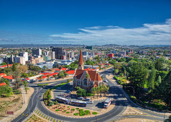 Aerial view of Windhoek city centre showing Christuskirche church, modern buildings and surrounding green spaces in Namibia