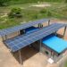 Solar mini-grid installation in rural Ghana providing off-grid electricity for community households and small businesses