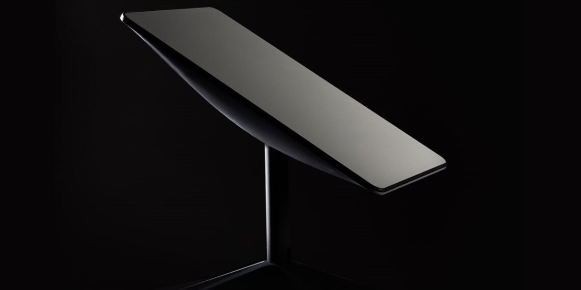 Starlink satellite internet terminal mounted on a stand against a dark background