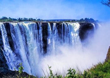 Victoria Falls in Zimbabwe with cascading water and mist, one of Africa’s most iconic natural tourism attractions