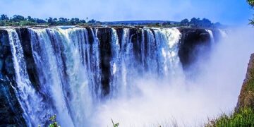 Victoria Falls in Zimbabwe with cascading water and mist, one of Africa’s most iconic natural tourism attractions