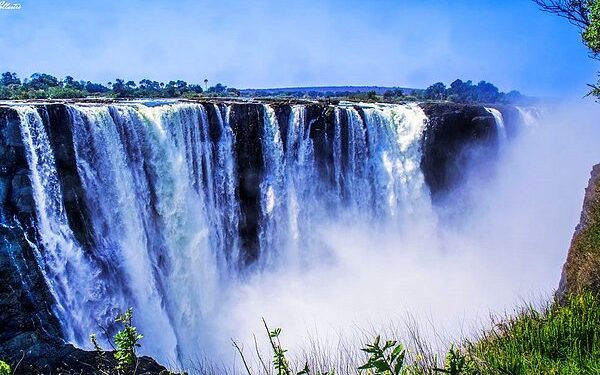 Victoria Falls in Zimbabwe with cascading water and mist, one of Africa’s most iconic natural tourism attractions
