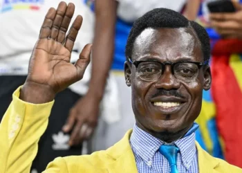 Congolese football supporter raises his hand in a Patrice Lumumba tribute pose during an AFCON match in Morocco