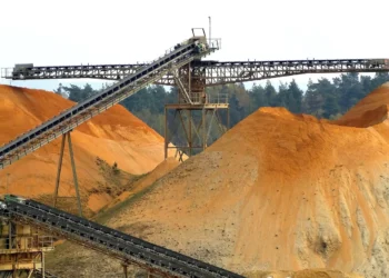 Copper ore stockpiles and conveyor systems at a large-scale mining operation in southern Africa, illustrating the copper production boom reshaping Zambia and DR Congo in 2025