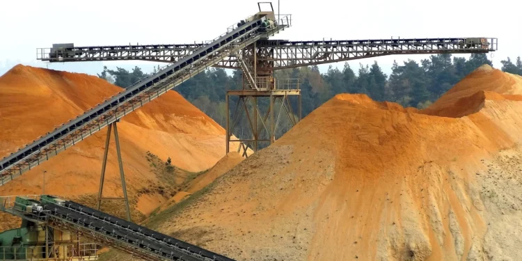 Copper ore stockpiles and conveyor systems at a large-scale mining operation in southern Africa, illustrating the copper production boom reshaping Zambia and DR Congo in 2025