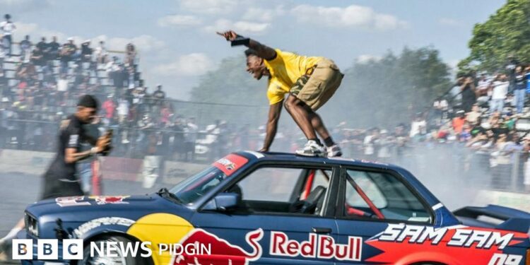 IShowSpeed performing a stunt atop a drifting car during his Africa tour, drawing crowds as fans film the viral moment.