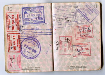 Open African passport showing multiple entry and exit stamps from Zambia, Botswana and Zanzibar.
