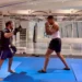 Anthony Joshua trains in a gym with a coach, practising pad work weeks after a fatal car crash in Nigeria