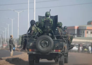 Nigerian soldiers patrol an urban road in an armed military vehicle amid intensified counterterror operations supported by the United States