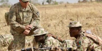 A US Army soldier instructs Nigerian Army personnel during a joint training exercise at a military facility in Jaji, Kaduna State, Nigeria