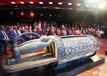 Djidji Ayokwe talking drum returned by France displayed during official restitution ceremony attended by French and Cote d’Ivoire officials in Paris