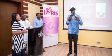 Speaker presenting during an iPRIS ICT policy and regulation training workshop with participants at a digital inclusion capacity-building session in West Africa